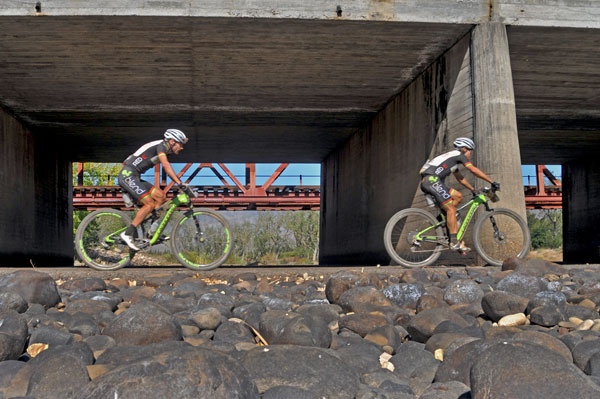 Team Blend/Red-E's Waylon Woolcock (pictured left) and Darren Lill pass near The Blockhouse bridge on stage 5 of the 2015 ABSA Cape Epic. Their ride on the day saw them regain the red 'African Jersey' Photo: Dino Lloyd/TreadMTB.co.za