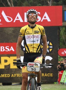 After crossing the line to win the 7th stage with his partner Jaroslav Kulhavy, Christoph Sauser of Burry Stander-SONGO looks to the heavens in memory of his friend Burry, during stage 6 of the 2013 Absa Cape Epic. Photo: Shaun Roy/Cape Epic/SPORTZPICS