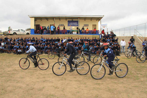 Pupils of the Enxolobeni Primary School pedalled on their bikes in front of their peers during the handover in Kwanyuswa Location, Mahlabathini, on the KwaZulu-Natal south coast on Wednesday 16 September.  Photo: Mylene Paynter