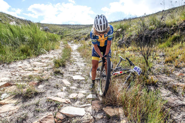 Jenny Sternerhag of Team Ascendis Health fixes a puncture on the side of the trail during the Fairview Attakwas Extreme in 2015. Another event known to take it's toll on equipment as well as riders. Photo: Oakpics