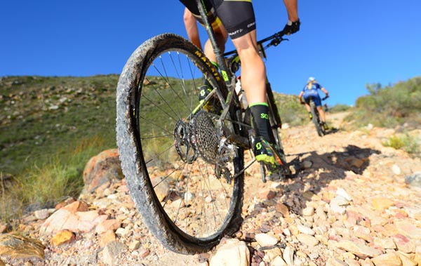 Early leader and former winner, Matthys Beukes of SCOTT LCB Factory Racing, completes a climb with a flat back tyre at the 2016 Fairview Attakwas Extreme Mountain Bike Challenge in South Africa on Saturday. Photo: www.zooncronje.com