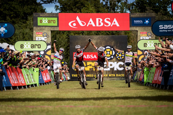 Gert Heyns and Matthys Beukes of SCOTT Factory Racing, flanked by team mates Nino Schurter and Philip Buys of SCOTT-Odlo MTB Racing win the final stage (stage 7) of the 2014 Absa Cape Epic. Photo: Nick Muzik/Cape Epic/SPORTZPICS