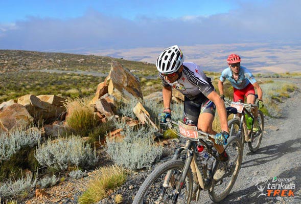 Swiss ace Christoph Sauser is accompanied by Germany’s Markus Bauer on the climb up the Merino Monster mountain during Stage 2 of the DUTOIT Tankwa Trek international mountain bike stage race in South Africa on Saturday. Photo: www.zooncronje.com