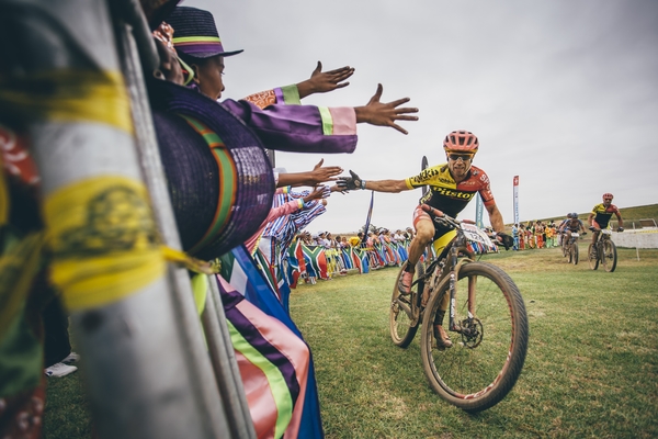 Niccolo Violati interacts with the crowd at a waterpoint during stage 4 of the 2016 Absa Cape Epic Mountain Bike stage race from the Cape Peninsula University of Technology in Wellington, South Africa on the 17th March 2016 Photo by Ewald Sadie/Cape Epic/SPORTZPICS 