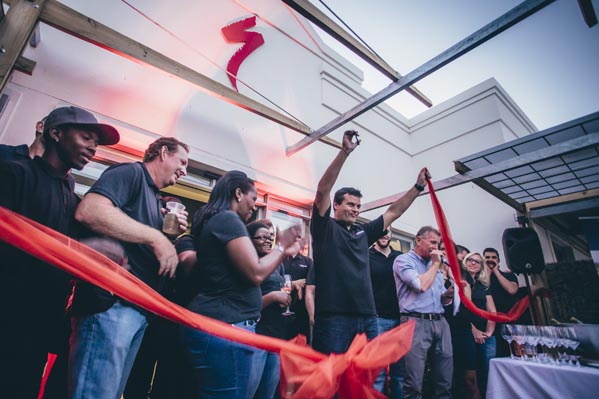 Peet le Roux and staff celebrate the official opening of the store during the ribbon cutting.  Photo: Ewald Sadie