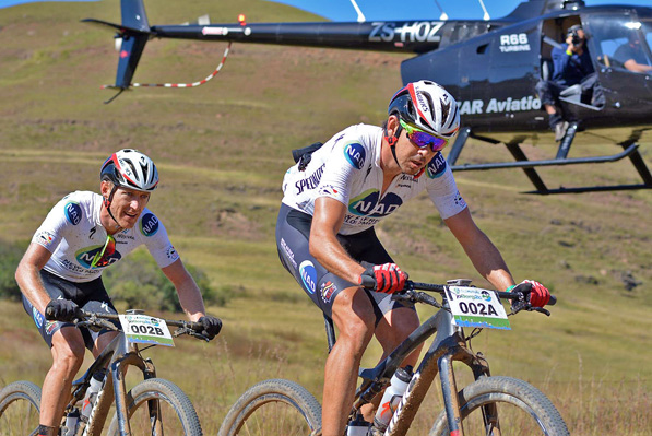 Nico Bell (front) and Gawie Combrinck of NAD Pro en route to winning the sixth stage of the 2016 Old Mutual joBerg2c between Nottingham Road and Glencairn on the Sani Pass road. Photo supplied.