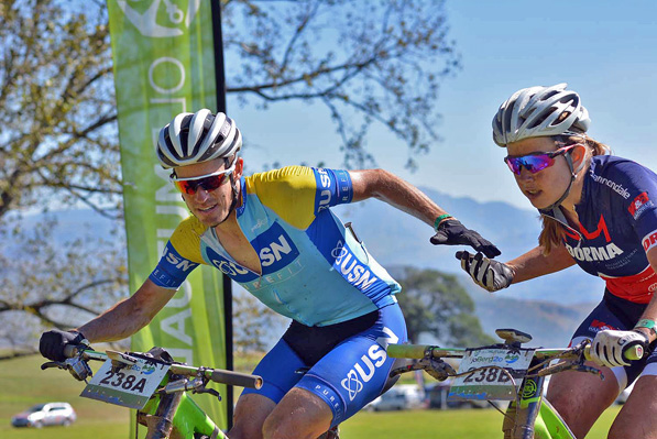 Darren Lill (left) and Candice Neethling celebrate after winning the sixth stage of the 2016 Old Mutual joBerg2c between Nottingham Road and Glencairn on the Sani Pass road. Photo supplied.