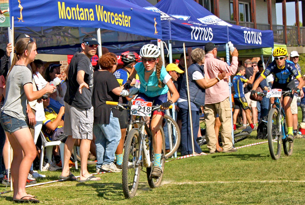 Grabbing water in the feedzone at the Spur Schools MTB League race in Worcester. Photo supplied.