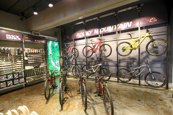 Intelligent use of vertical wall space, black backdrop and appropriate lighting ensure the Rocky Mountain bikes on sale at THIS WAY OUT, Cape Town are well displayed.