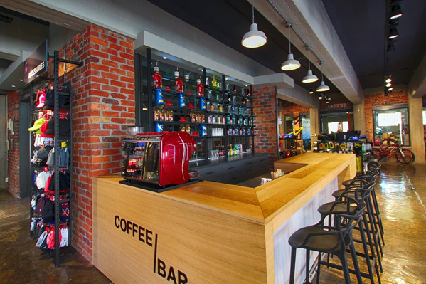 A full-time barista creates high quality coffee-bar fare for customers at THIS WAY OUT Cape Town.