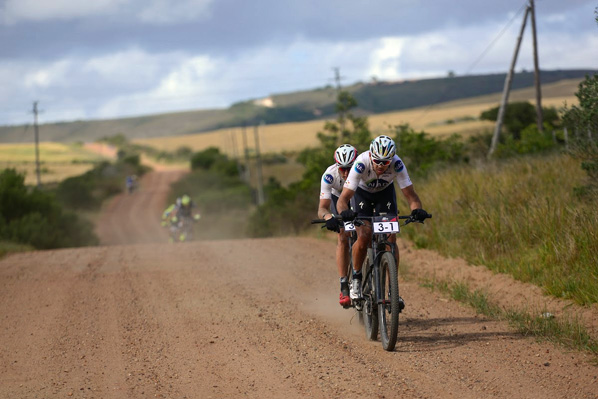 The aggression of Nico Bell (front) and Gawie Combrinck of Team NAD paid off as they claimed the stage win and took the overall lead at the Cape Pioneer Trek international mountain bike stage race in Mossel Bay, South Africa on Monday. Photo: www.zcmc.co.za