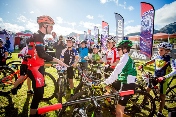 Olympian James Reid mentors some of the younger riders. Photo: Chris Hitchcock