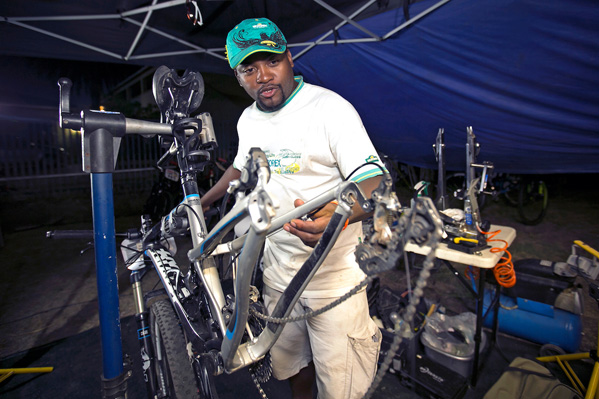 A tech zone mechanic goes over finishing touches to prep a bike for it's next stage. Photo: Mark Sampson/Cape Epic/SPORTZPICS