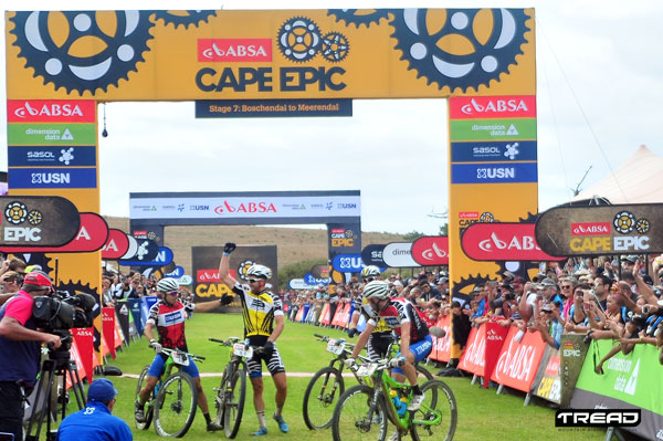 Yellow Jersey wearers Urs Huber and Karl Platt (Team Bulls) are congratulated on their cape Epic win by Red Jersey (Africa) wearers, Darren Lill and Waylon Woolcock of Team USN. Photo: Dino Lloyd