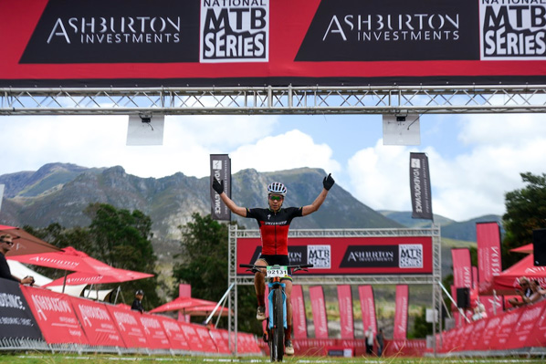 A victorious Annika Langvad (Specialized) comfortably crosses the finish line 5min ahead of runner up Robyn de Groot. Photo: www.zcmc.co.za